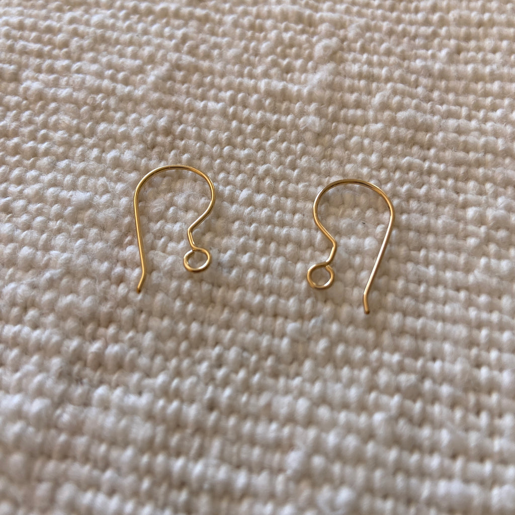 This is a custom add on for any of our earrings with hooks. We will swap the existing earring hooks for 14k gold  or sterling silver earring hooks. It will come as a ready to wear pair of earrings with the hooks of your choice attached.